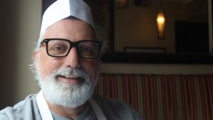 Walter Moreschi is the co-owner of Mamma Teresa. While he normally wears a suit and tie, on Jan. 18 he changed into an apron to replace a staff member who called in sick. Photo by Zenith Wolfe