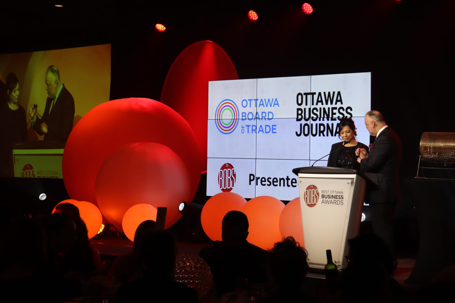 Sueling Ching (right) and Michael Curran present at the Best Ottawa Business Awards. (Photo by Mia Jensen)