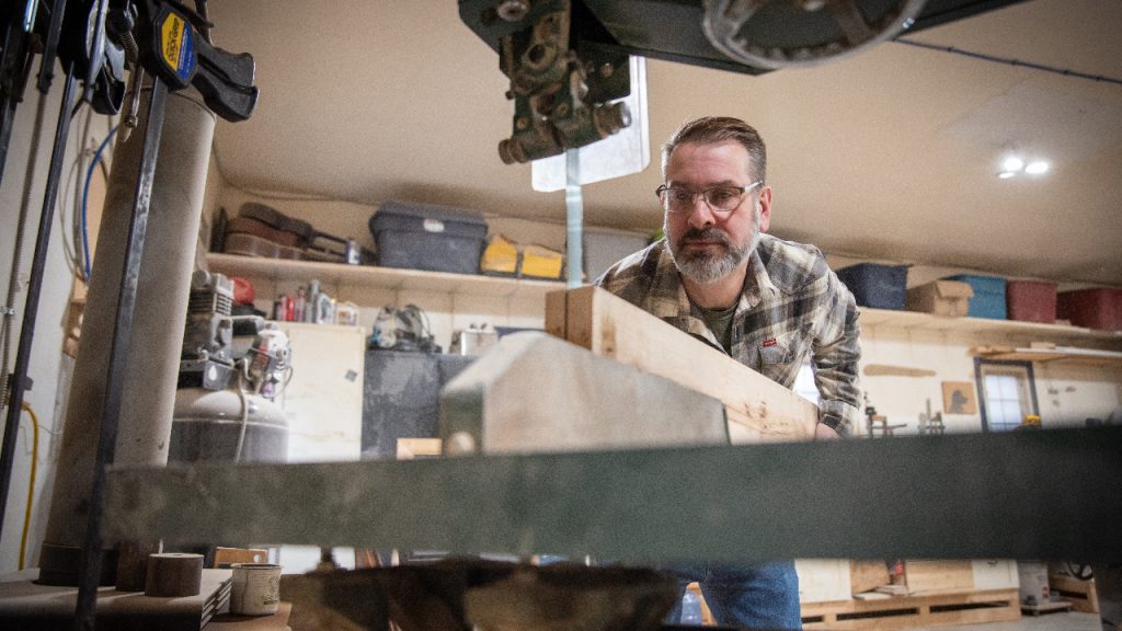 Patrick Risdon started a woodworking business, turning salvaged wood into bespoke furniture. Photo by Joseph Coppolino.