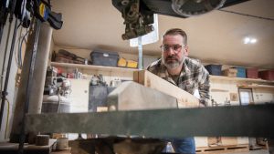 Patrick Risdon started a woodworking business, turning salvaged wood into bespoke furniture. Photo by Joseph Coppolino.