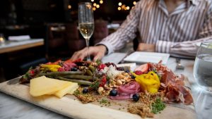 Charcuterie and sparkling wine for happy hour at Social. Photo by Yvonne Langen