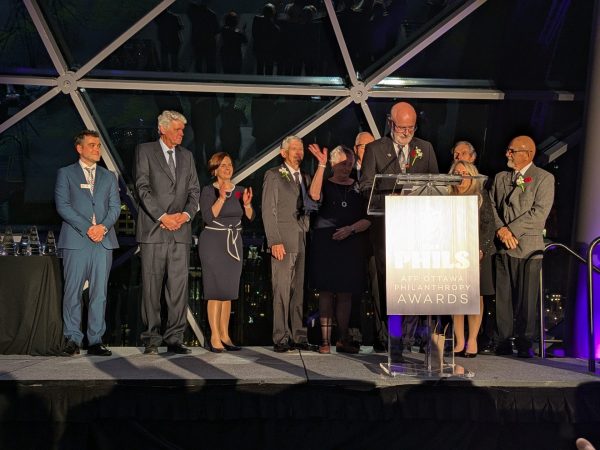 Murray St. Louis, director of the Ottawa Senators Goodwill Ambassadors, accepts the outstanding philanthropic group award on behalf of the organization. Photo by Nickie Shobeiry.