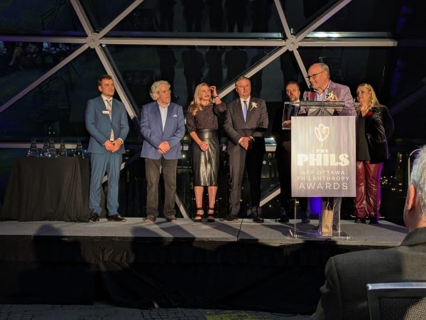 Nathan Smith, executive vice-president at Cushman & Wakefield, accepts the company's award for outstanding small business philanthropist. Photo by Nickie Shobeiry.