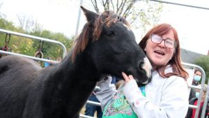 Trina Mather-Simard, CEO of Indigenous Experiences' Mādahòkì Farm with one of the Farm's Ojibwe Spirit Horses.